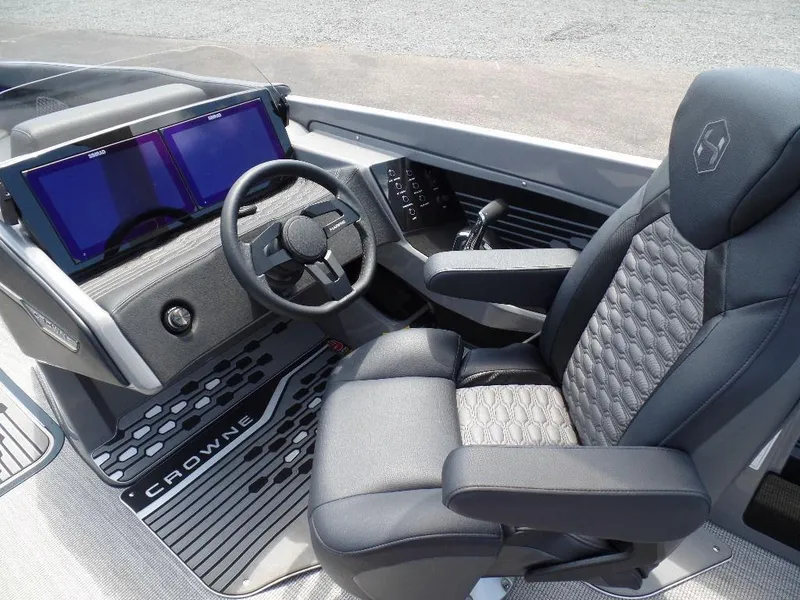 Slide: The Image of 2025 Harris Crowne 250 boat cockpit with modern steering and dual screens. - 22