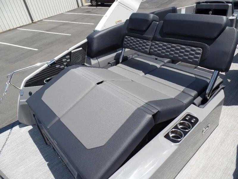 Slide: The Image of 2025 Harris Crowne 250 boat interior with luxurious seating and cup holders. - 25