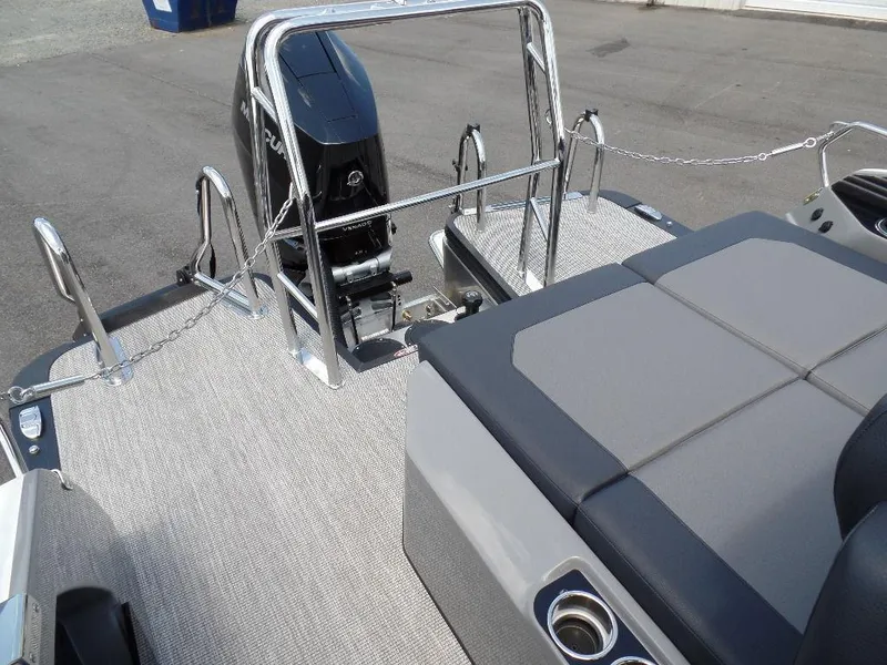 Slide: The Image of 2025 Harris Crowne 250 boat deck with seating and motor. - 26