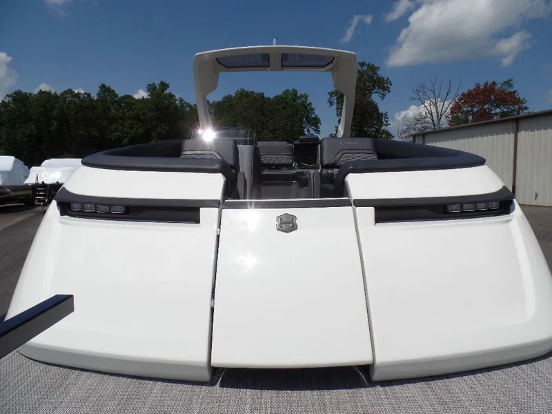 Slide: The Image of 2025 Harris Crowne 250 boat, sleek white design, outdoor setting. - 3