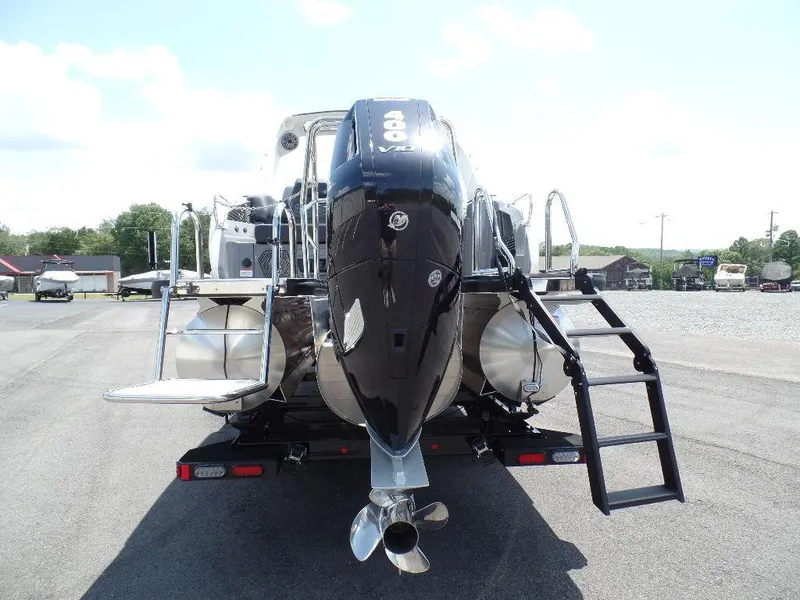 Slide: The Image of 2025 Harris Crowne 250 boat with powerful outboard motor and sleek design. - 31