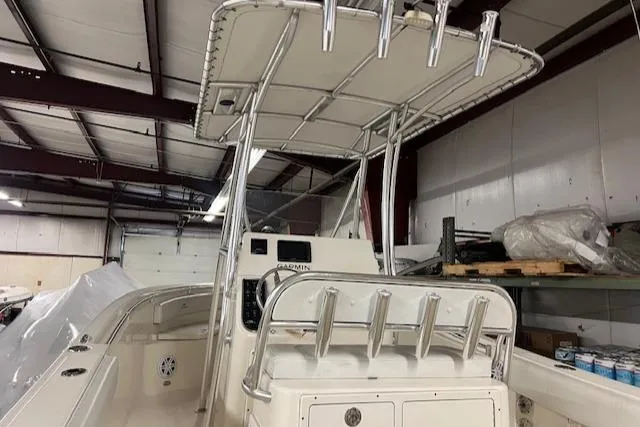 Slide: The Image of 2021 Cobia 237 Center Console boat in indoor storage. - 15