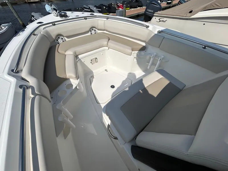 Slide: The Image of 2024 Boston Whaler 230 Outrage boat interior with helm station and seating. - 12