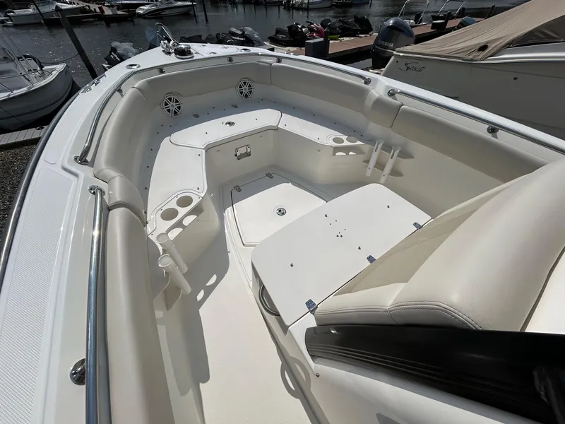 Slide: The Image of 2024 Boston Whaler 230 Outrage boat interior with helm and seating. - 13