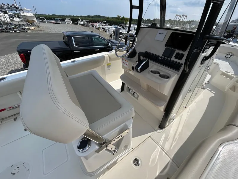 Slide: The Image of 2024 Boston Whaler 230 Outrage boat with powerful outboard engine. - 8