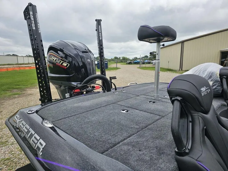 Slide: The Image of 2025 Skeeter ZXR21 bass boat with Yamaha SHO engine, rear deck view. - 10