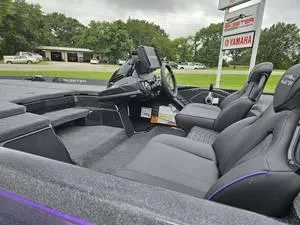 Slide: The Image of 2025 Skeeter ZXR21 boat interior with modern dashboard and comfortable seating. - 19