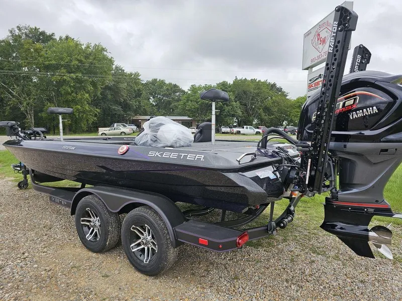 Slide: The Image of 2025 Skeeter ZXR21 bass boat with Yamaha engine on a trailer. - 8