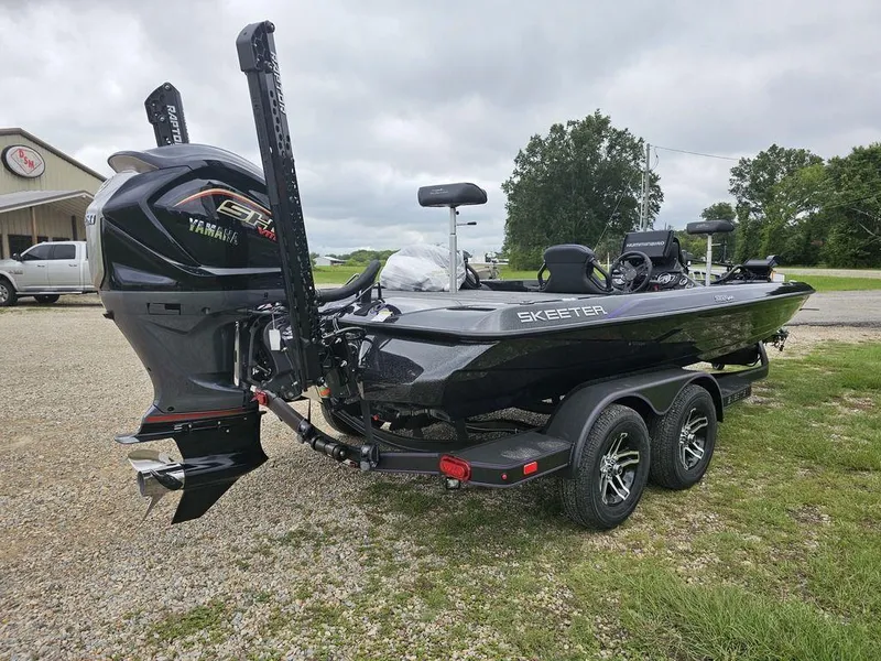 Slide: The Image of 2025 Skeeter ZXR21 bass boat with Yamaha engine on trailer. - 9