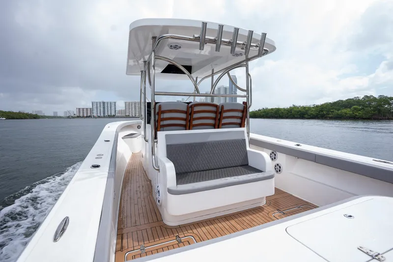 Slide: The Image of 2023 Seahorse 36 CC boat with sleek seating and modern design on the water. - 15