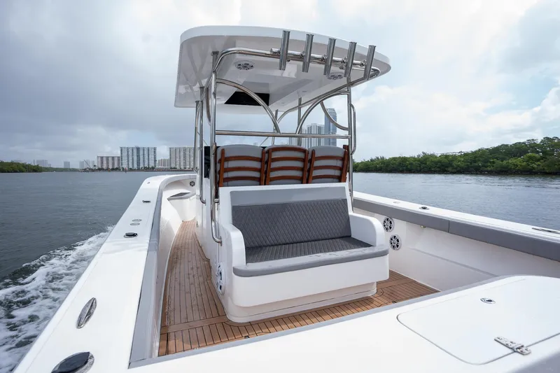 Slide: The Image of 2023 Seahorse 36 CC boat with sleek design and spacious seating on the water. - 16