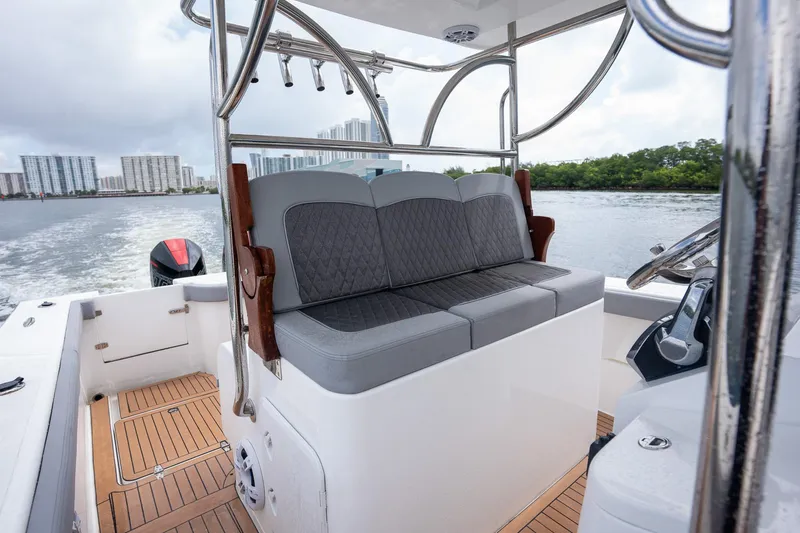 Slide: The Image of 2023 Seahorse 36 CC boat interior with cushioned seating and sleek design. - 19