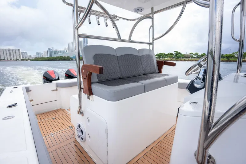 Slide: The Image of 2023 Seahorse 36 CC boat interior with cushioned seating and wooden deck. - 20