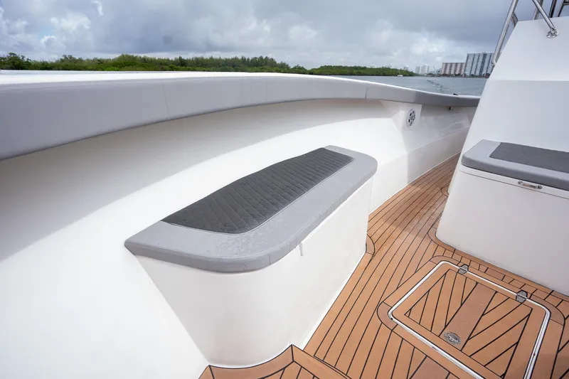 Slide: The Image of 2023 Seahorse 36 CC boat deck with cushioned seating and wood flooring. - 23