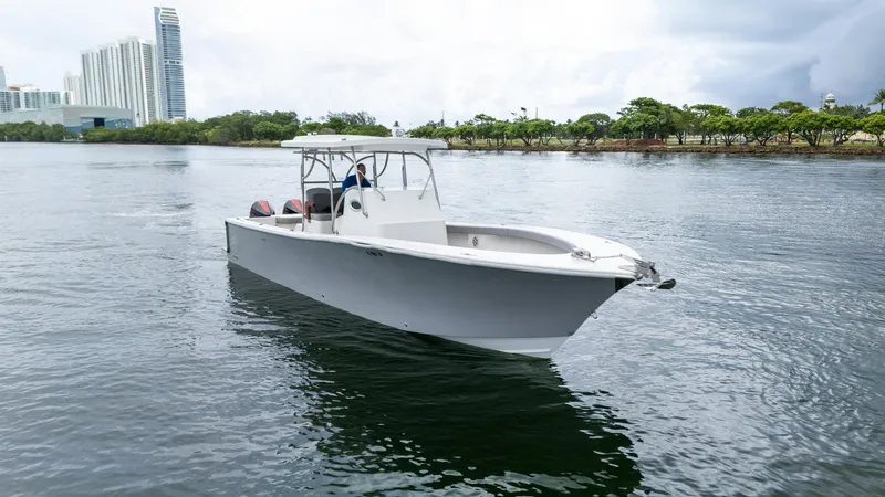 Slide: The Image of 2023 Seahorse 36 CC boat on calm water near city skyline. - 6