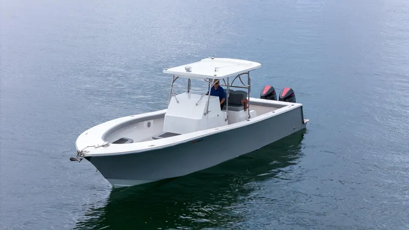 Slide: The Image of 2023 Seahorse 36 CC boat on calm water with dual engines. - 9