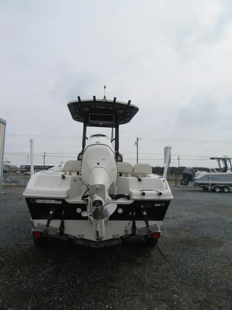 Slide: The Image of 2016 Carolina Skiff Sea Chaser 22 HFC boat, rear view, in a parking lot. - 3