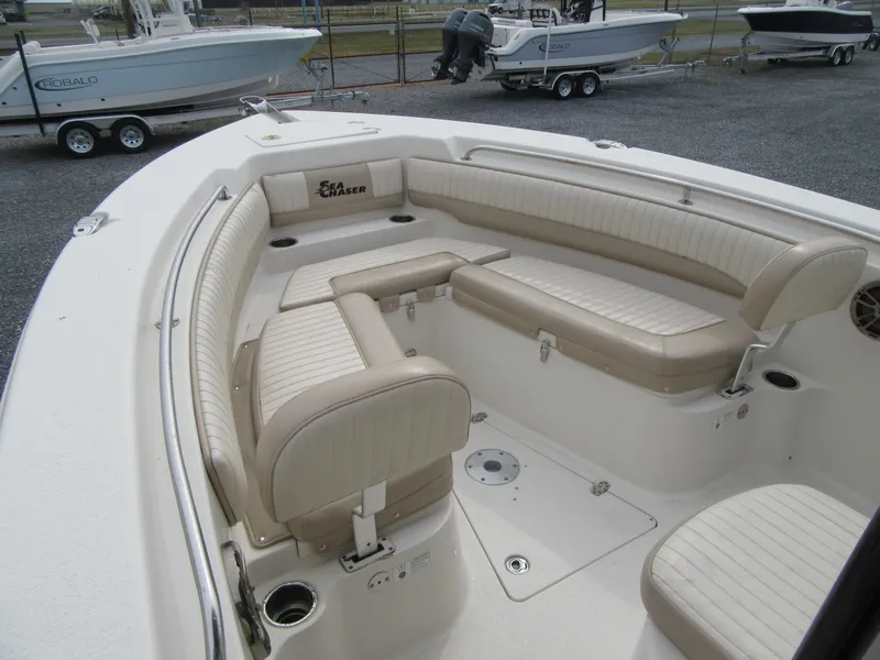 Slide: The Image of 2016 Carolina Skiff Sea Chaser 22 HFC boat interior with beige seating. - 4