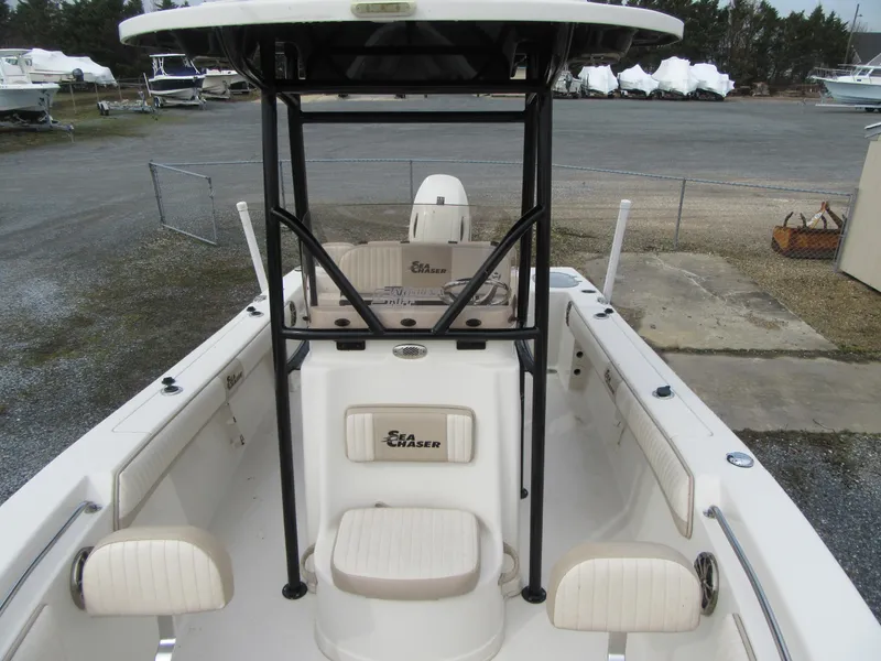 Slide: The Image of 2016 Carolina Skiff Sea Chaser 22 HFC boat interior with seating and console. - 5