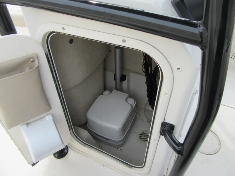 Slide: The Image of 2016 Carolina Skiff Sea Chaser 22 HFC boat interior storage compartment. - 8
