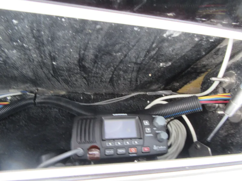 Slide: The Image of 2016 Carolina Skiff Sea Chaser 22 HFC radio and wiring compartment. - 9