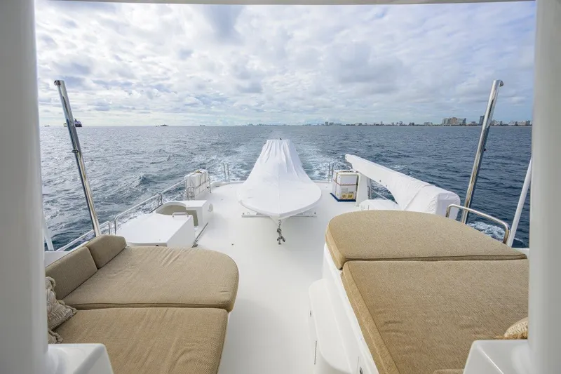 Slide: The Image of Luxurious 2008 Westport 112 yacht deck with ocean view and comfortable seating. - 10