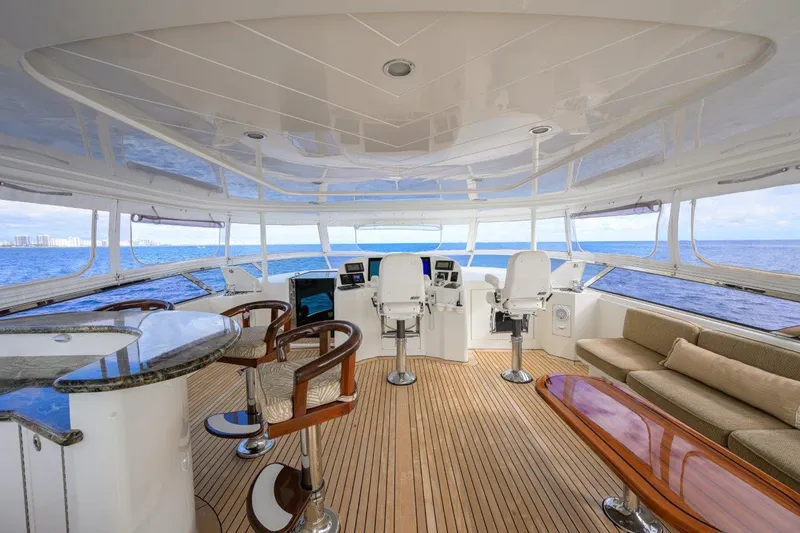 Slide: The Image of Luxurious 2008 Westport 112 yacht interior with elegant seating and ocean views. - 11
