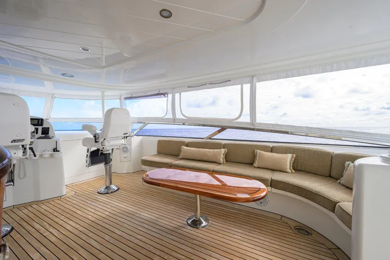 Slide: The Image of Luxurious 2008 Westport 112 yacht interior with plush seating and ocean views. - 12