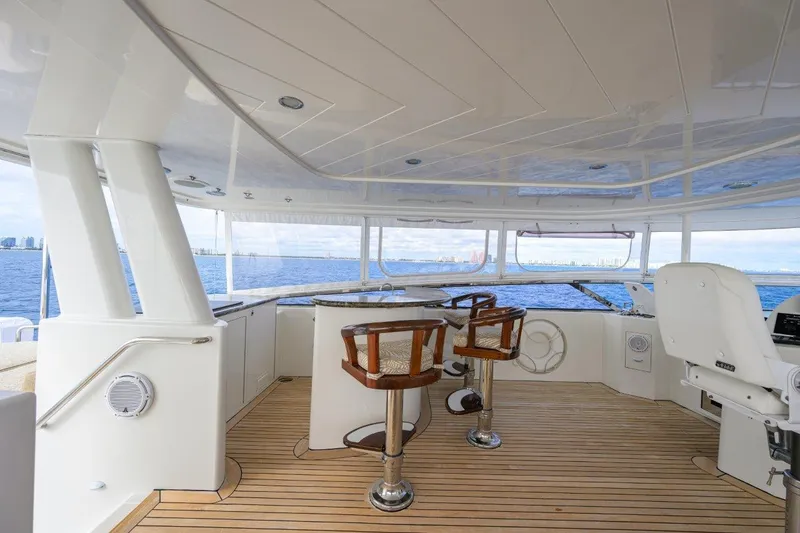 Slide: The Image of Luxurious 2008 Westport 112 yacht interior with ocean view and elegant seating. - 13