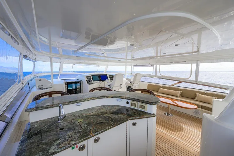 Slide: The Image of Luxurious 2008 Westport 112 yacht interior with modern helm, seating, and ocean view. - 15