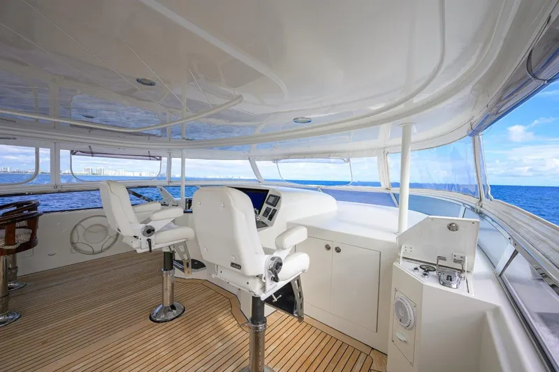 Slide: The Image of Luxurious 2008 Westport 112 yacht helm with ocean view and modern controls. - 16