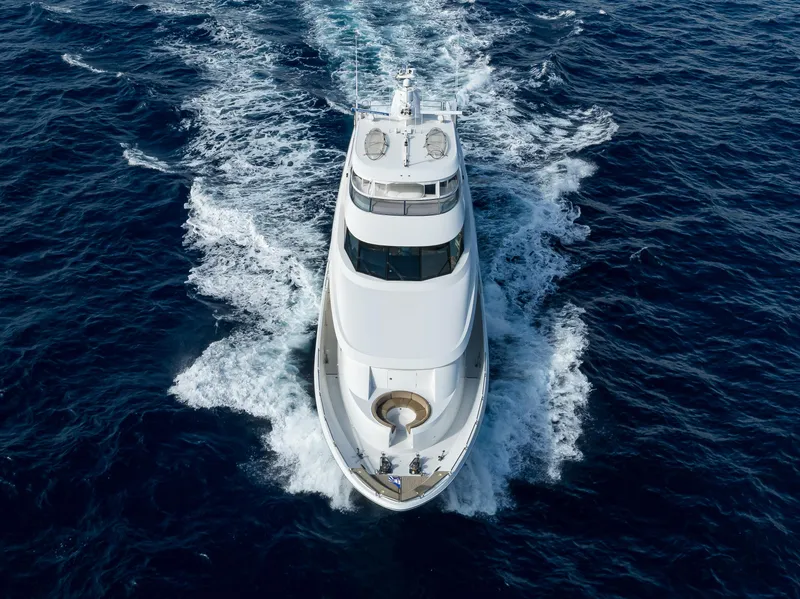 Slide: The Image of Aerial view of 2008 Westport 112 yacht cruising on open sea. - 2