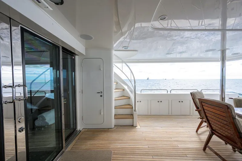 Slide: The Image of Luxurious 2008 Westport 112 yacht deck with ocean view and elegant seating. - 21