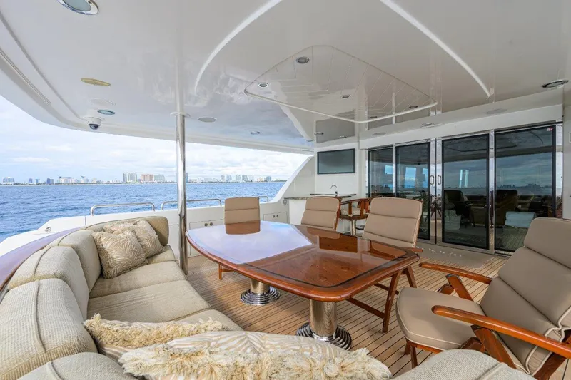 Slide: The Image of Luxurious 2008 Westport 112 yacht deck with elegant seating and ocean view. - 25