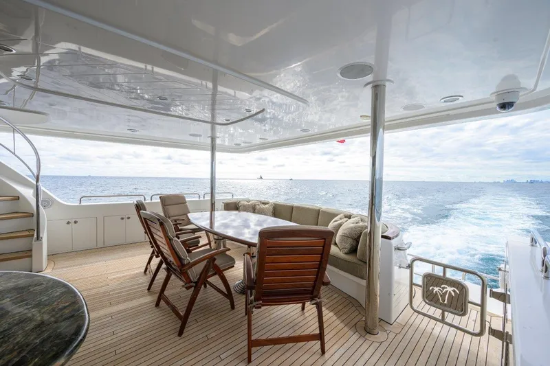 Slide: The Image of Luxurious 2008 Westport 112 yacht deck with ocean view and elegant seating area. - 26