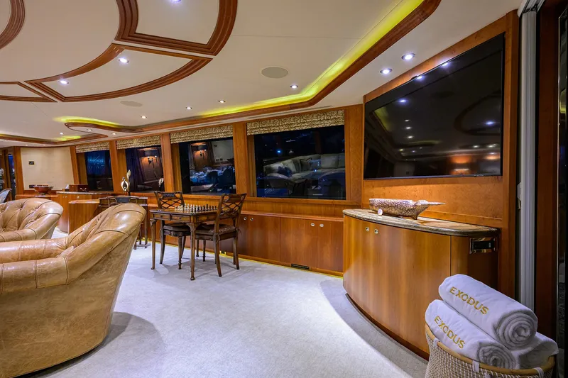 Slide: The Image of Luxurious interior of 2008 Westport 112 yacht with elegant wood finishes and plush seating. - 30