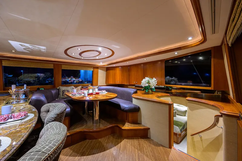 Slide: The Image of Luxurious interior of 2008 Westport 112 yacht with elegant dining area and wood finishes. - 36