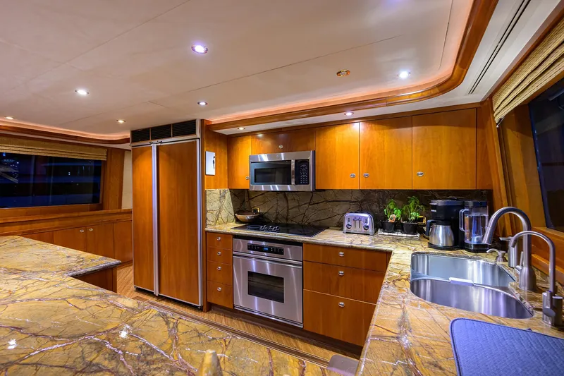 Slide: The Image of Luxurious kitchen interior on 2008 Westport 112 yacht with modern appliances and marble countertops. - 43