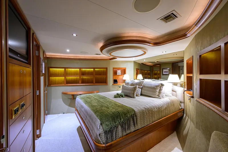 Slide: The Image of Luxurious bedroom interior on 2008 Westport 112 yacht, featuring elegant wood accents and ambient lighting. - 44
