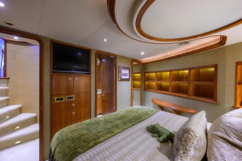 Slide: The Image of Luxurious bedroom interior on 2008 Westport 112 yacht, featuring elegant wood accents and modern amenities. - 45