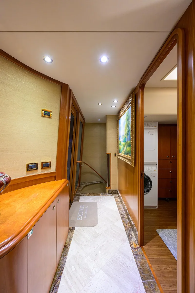 Slide: The Image of Luxurious hallway in 2008 Westport 112 yacht with elegant wood finishes and modern lighting. - 46
