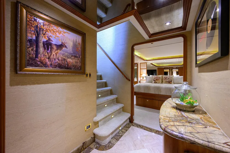 Slide: The Image of Luxurious interior of 2008 Westport 112 yacht with elegant staircase and artwork. - 51