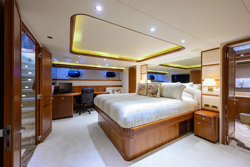 Slide: The Image of Luxurious bedroom interior on 2008 Westport 112 yacht, featuring elegant wood finishes and modern amenities. - 54