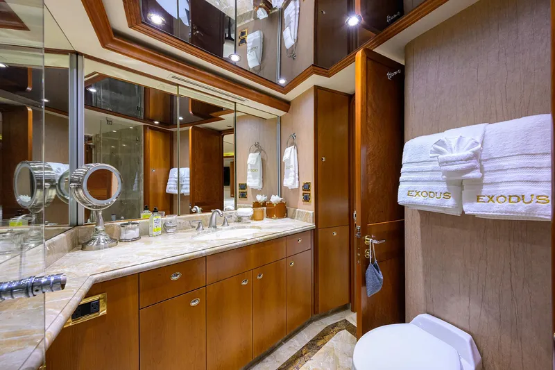 Slide: The Image of Luxurious bathroom on 2008 Westport 112 yacht with elegant wood cabinetry and marble countertop. - 57