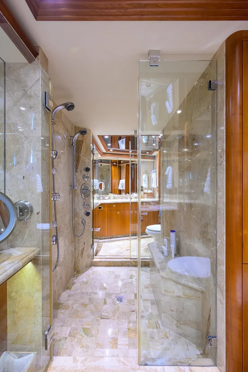 Slide: The Image of Luxurious bathroom in 2008 Westport 112 yacht with glass shower and marble finishes. - 58