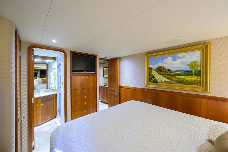 Slide: The Image of Luxurious bedroom interior on 2008 Westport 112 yacht with elegant wood paneling and artwork. - 61
