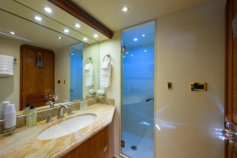 Slide: The Image of Luxurious bathroom in 2008 Westport 112 yacht with marble countertop and glass shower. - 62