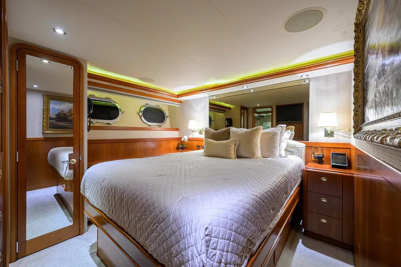 Slide: The Image of Luxurious bedroom interior on 2008 Westport 112 yacht with elegant wood finishes. - 63