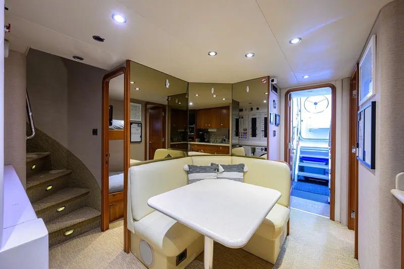 Slide: The Image of Luxurious interior of 2008 Westport 112 yacht with cozy dining area and modern lighting. - 67