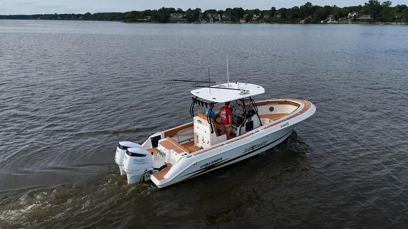 Slide: The Image of 2000 Hydra-Sports 2796 Vector boat cruising on a lake. - 10